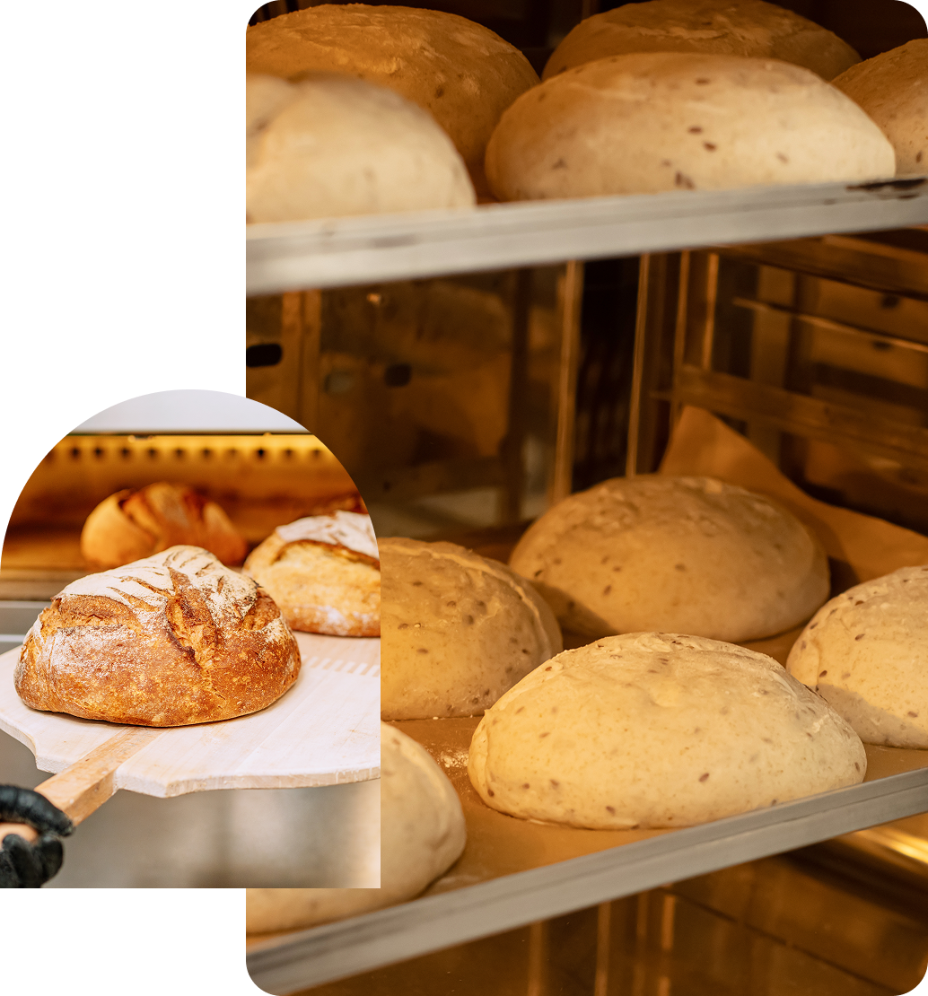 Group 9 A bakery with several trays of bread in it.