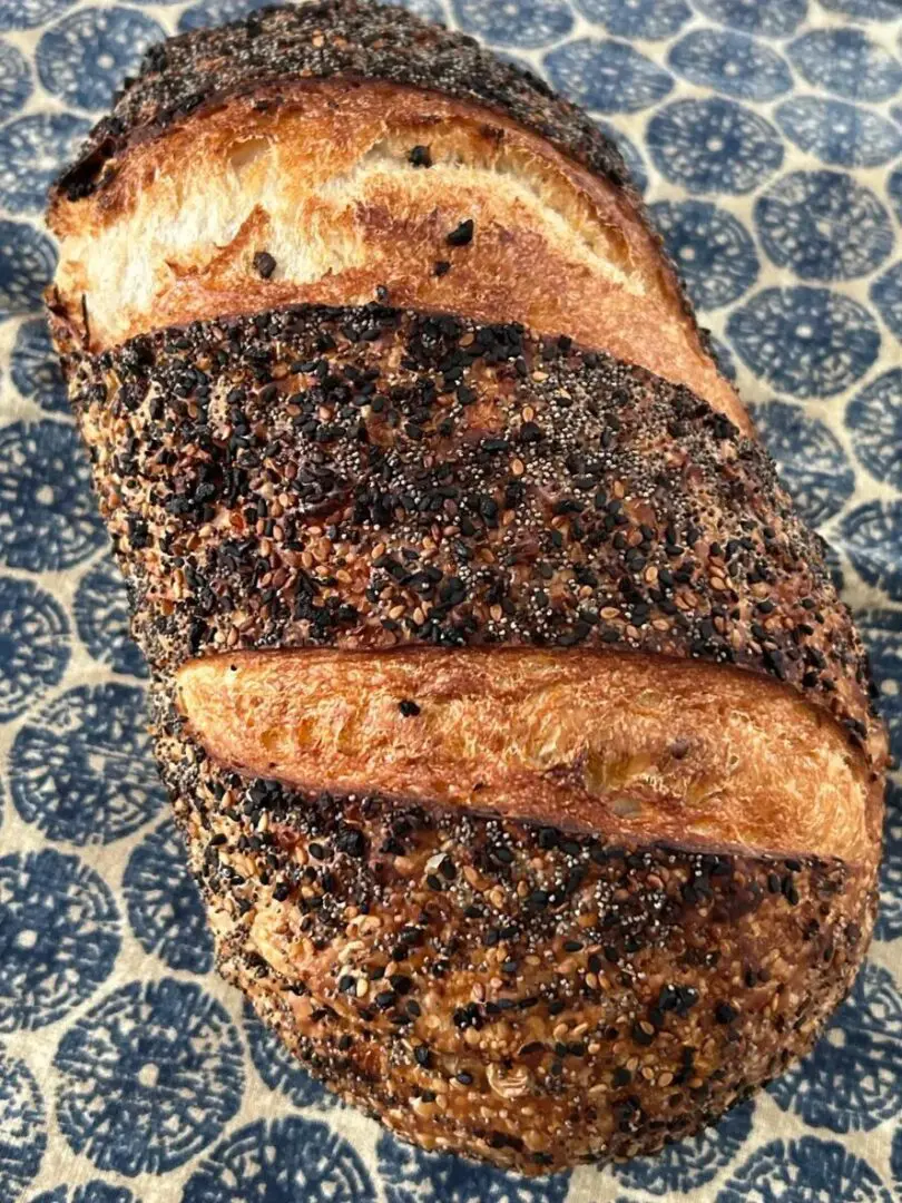 A loaf of bread with black and brown speckles.