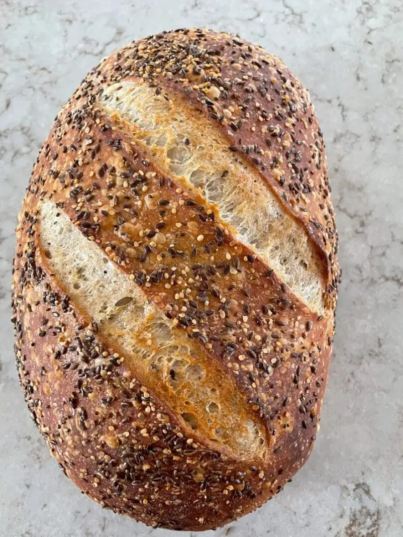 A loaf of bread with sesame seeds on it.